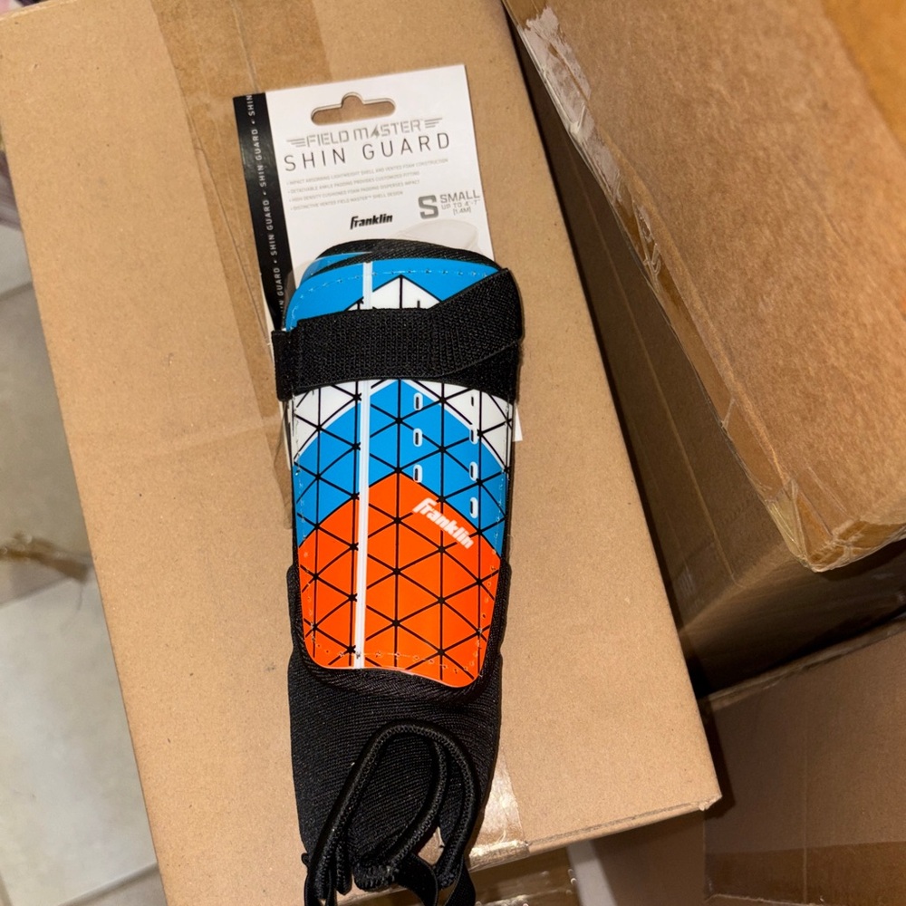 Field Master Shin Guard with Blue and Orange Design